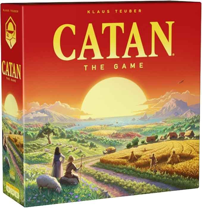 Catan strategy board game box and hexagonal resource tiles