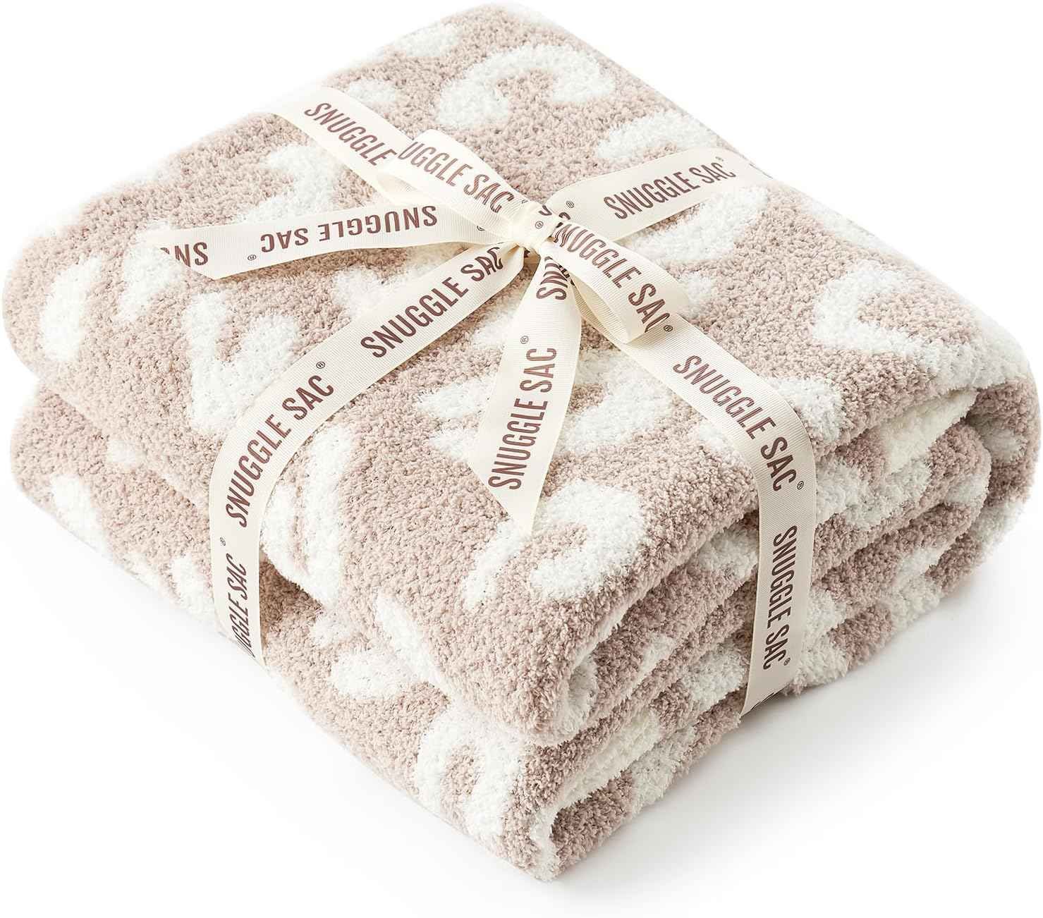Leopard print throw blanket draped over a chair