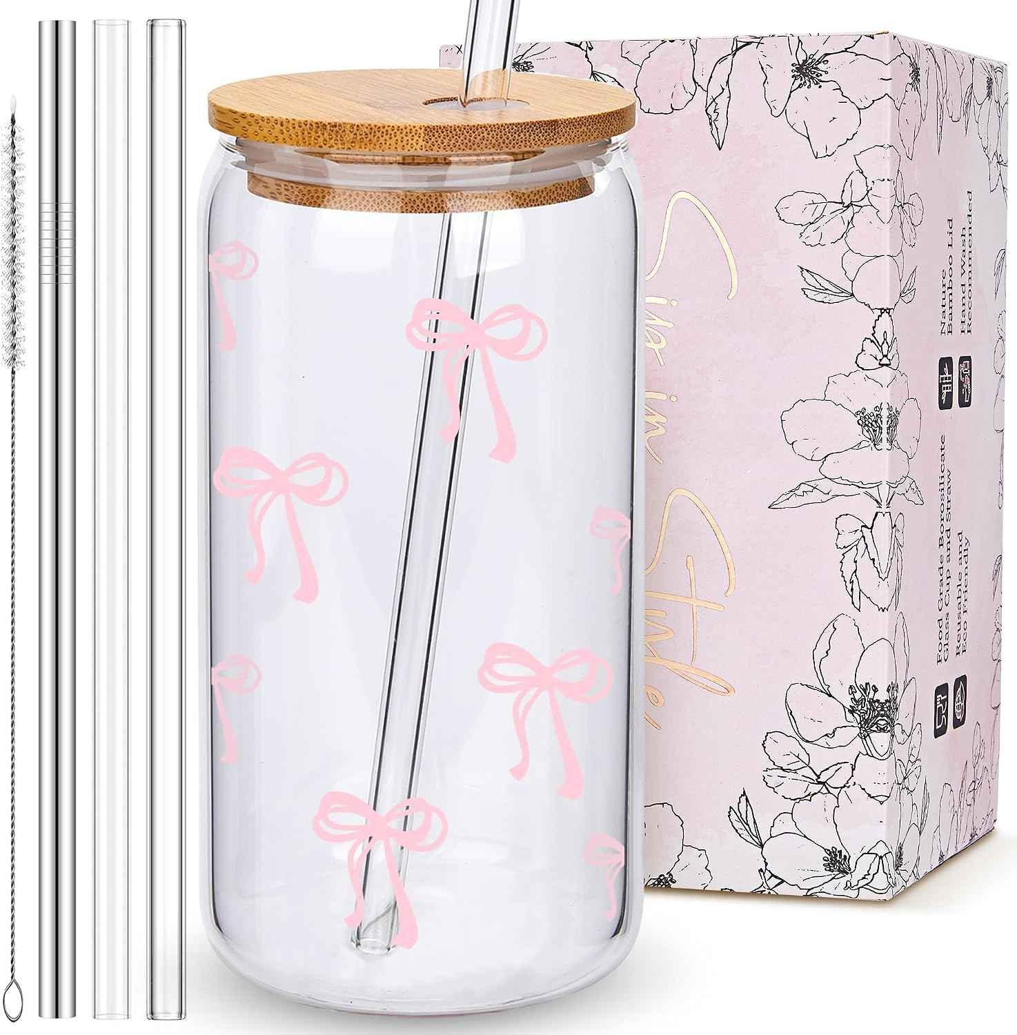 Set of four pink bow glass cups with lids and straws
