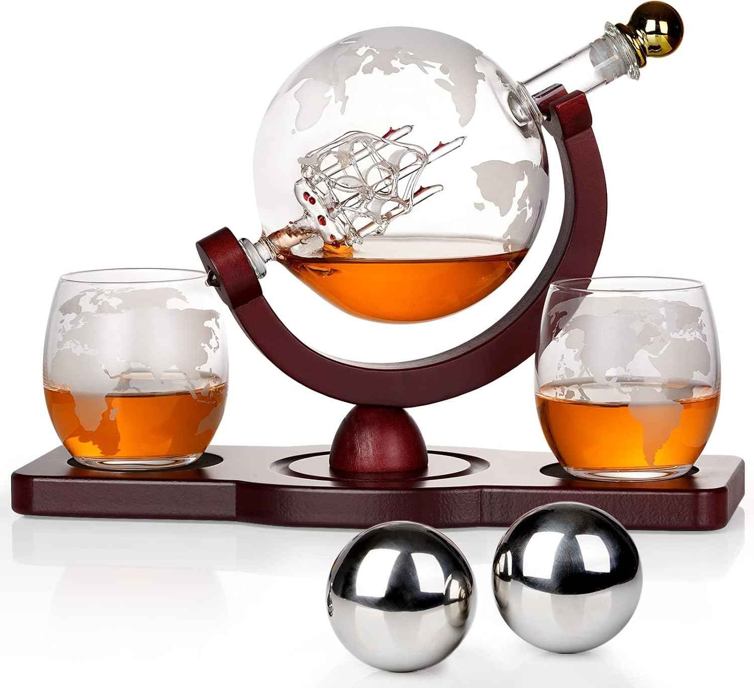 Etched glass globe whiskey decanter with internal glass ship and chilling stones